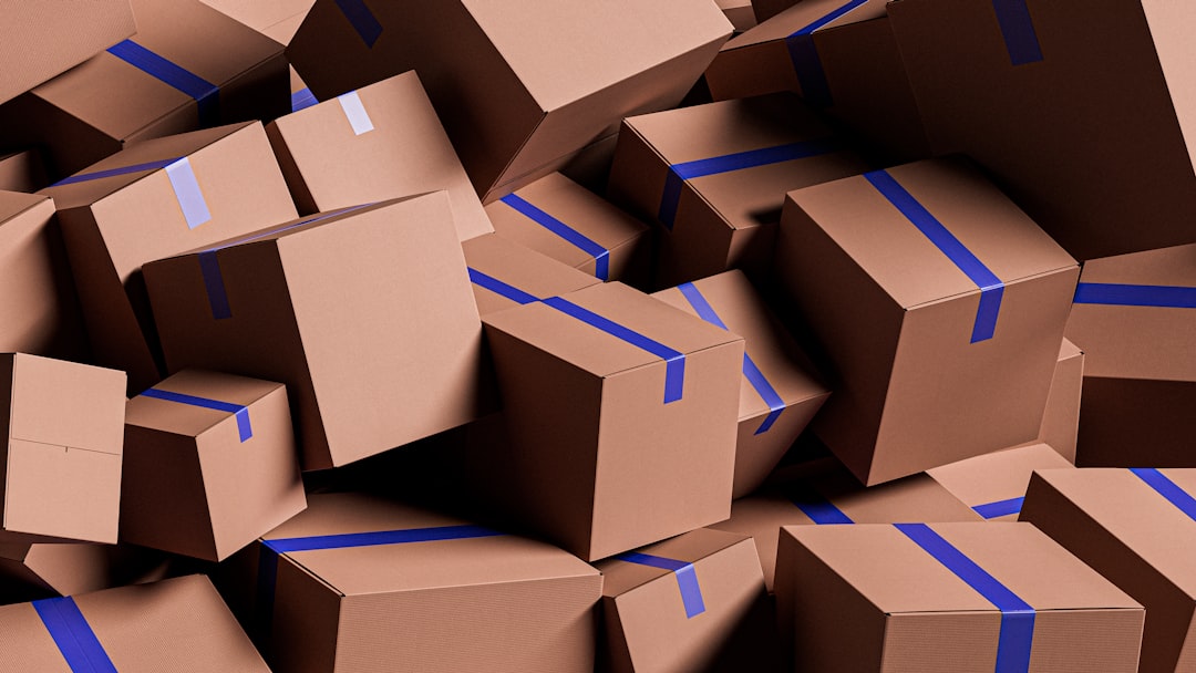a-large-pile-of-brown-cardboard-boxes-with-blue-tape-qo2ztaz5g7a